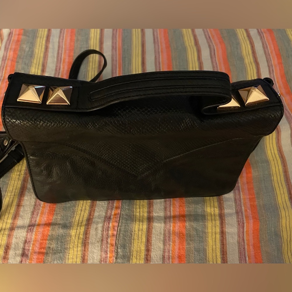 Linea Pelle black leather purse with goldtone studs and hardware